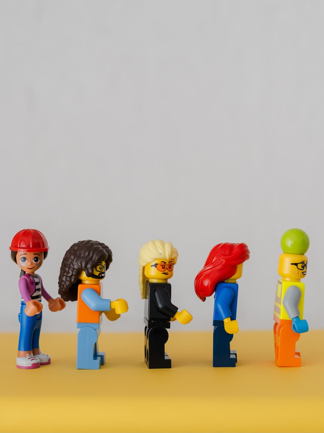 A line of LEGO figures representing different perspectives